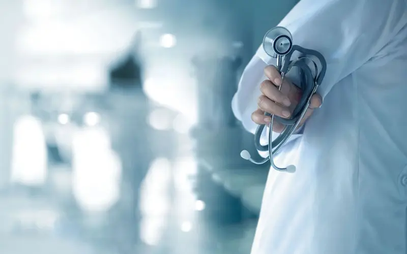 Section 1000x750_0000s_0019_doctor-with-stethoscope-hand-hospital-background-medical-medicine-concept (Large)